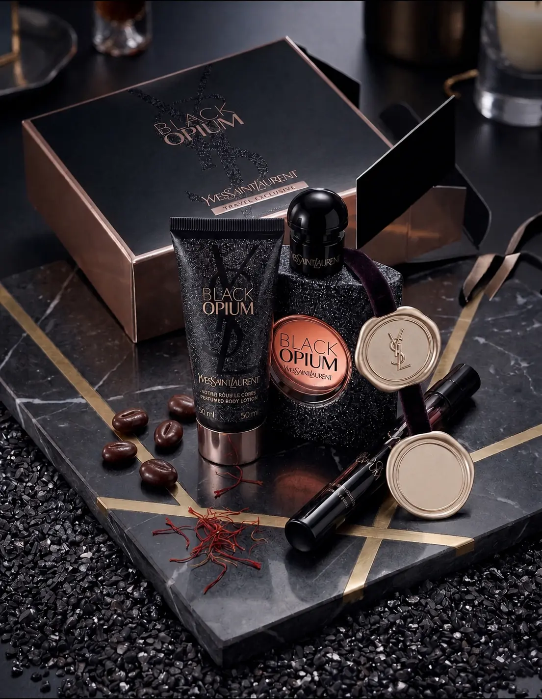 Yves Saint Laurent Black Opium arranged on dark marble with a gold wax seal, coffee beans and saffron threads